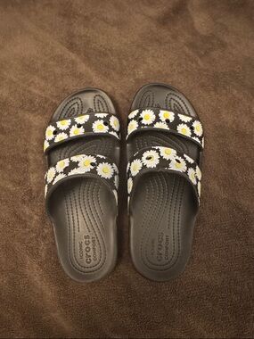 CROCS Black Slide Sandals with White & Yellow Daisy Print